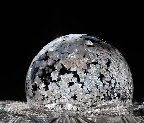 USA, Indiana, Carmel. Frozen soap bubble on a crystal glass base. Fashion Print